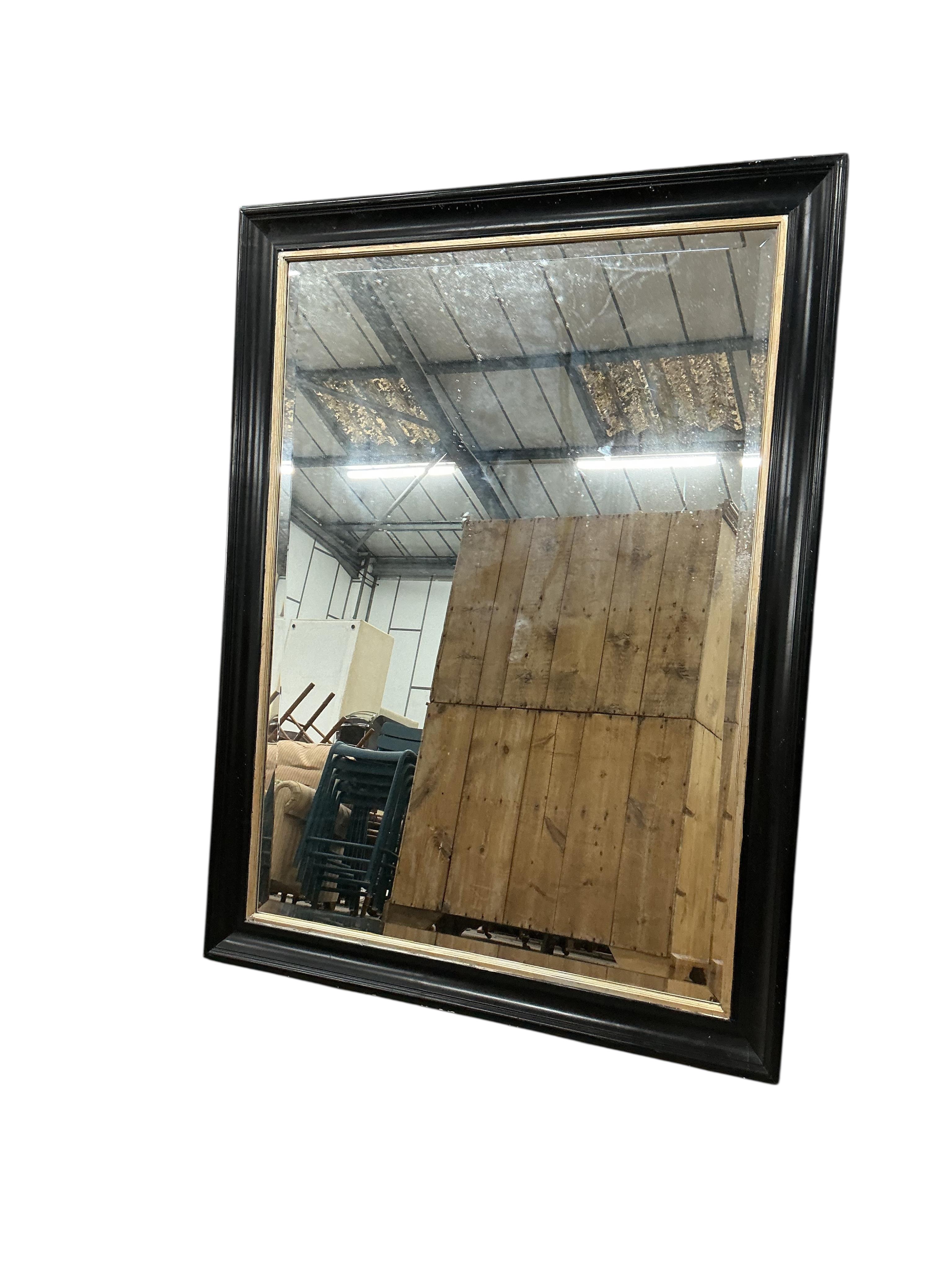 A Victorian style rectangular ebonised wall mirror, width 110cm, height 147cm